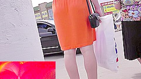 Spektakulärer Upskirt in orangefarbenem Glanz - free porn video