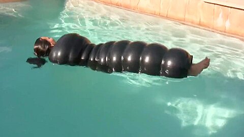 Inflatable Latex Woman Pumps Up In Pool - free porn video